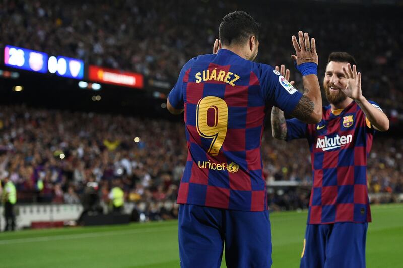 Luis Suarez celebrates his goal with Lionel Messi. AFP