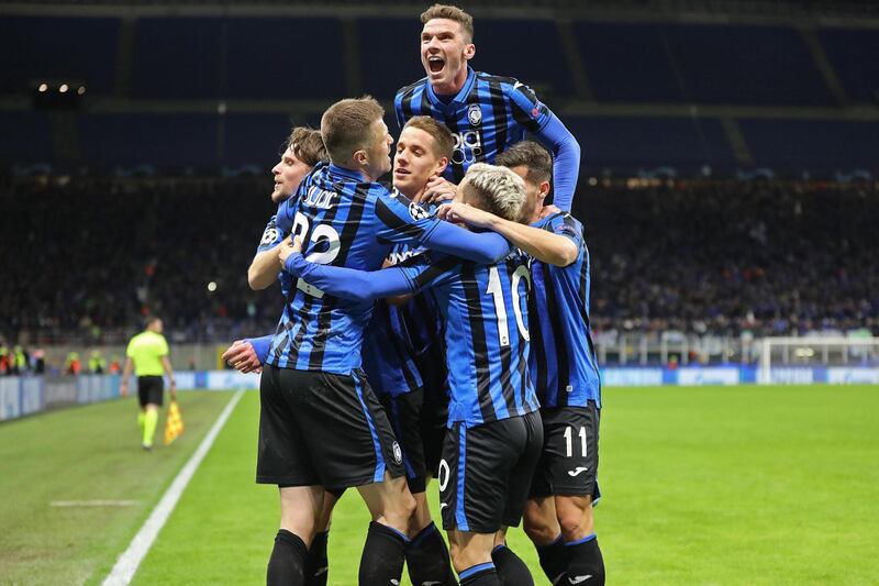 Hans Hateboer (L) celebrates with teammates after scoring his second goal. Atalanta won 4-1.  EPA