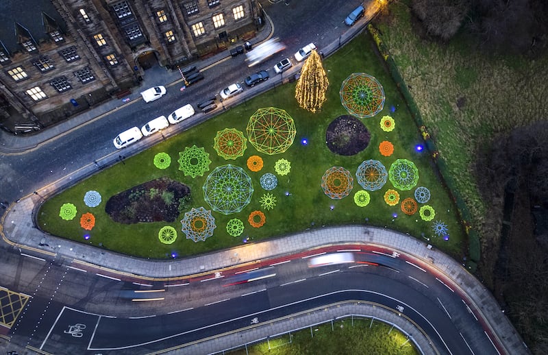 Geometric neon snowflakes created by artist Hannah Ayre were pictured from above on Wednesday in Edinburgh. The artworks surround the city's Christmas Tree on The Mound. PA