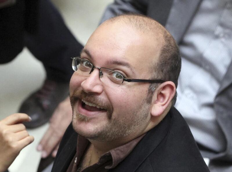 Jason Rezaian, an Iranian-American correspondent for the Washington Post, smiles as he attends a presidential campaign of president Hassan Rouhani in Tehran, Iran. Vahid Salemi / AP Photo