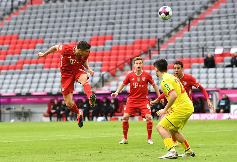 Bayern's Robert Lewandowski heads for goal. AFP