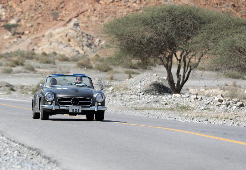 A Mercedes-Benz 190 SL goes up a slope.