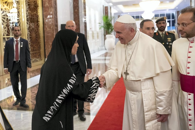 ABU DHABI, UNITED ARAB EMIRATES - February 3, 2019: Day one of the UAE Papal visit - HE Dr Amal Abdullah Al Qubaisi, Speaker of the Federal National Council (FNC) (L) greets His Holiness Pope Francis, Head of the Catholic Church (C), at the Presidential Airport. 

( Ryan Carter / Ministry of Presidential Affairs )
---