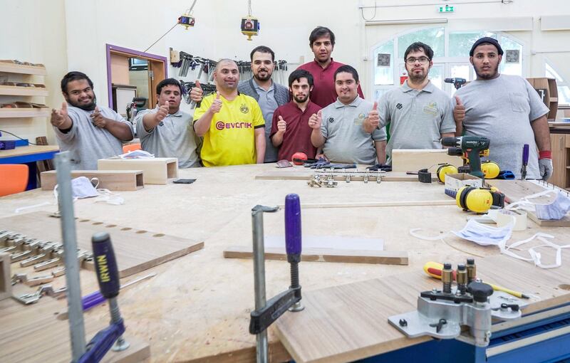 Abu Dhabi, United Arab Emirates, February 13, 2020.  
   Story Brief:  A story on the carpentry workshop at Zayed High Organisation for people of determination, where people with special needs aremaking tables and podiums that are used in government buildings and mosques. 

--  Carpenter voluteers at the workshop.


Victor Besa / The National
Section:  NA
Reporter:  Haneen Dajani