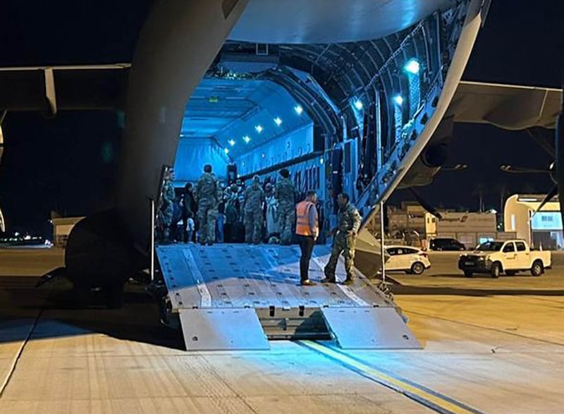 British citizens in a transport plane at Larnaca International Airport in Cyprus, having been flown from Sudan. PA