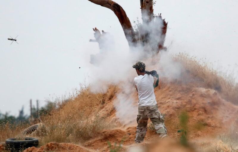 A fighter loyal to Libya's UN-backed government (GNA) fires a RPG during a clash with forces loyal to Khalifa Haftar at the outskirts of Tripoli, Libya.  Reuters