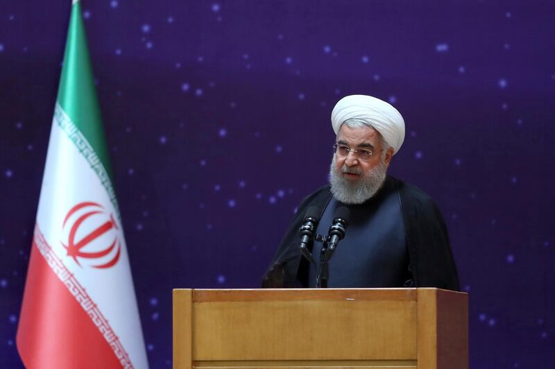 In this photo released by an official website of the office of the Iranian Presidency, President Hassan Rouhani speaks in a ceremony to mark "National Nuclear Day," dedicated to the country's achievements in nuclear technology, in Tehran, Iran, Monday, April 9, 2018. Rouhani said Monday that despite many attempts, the U.S. has "failed to destroy" the landmark 2015 deal between Iran and world powers. (Iranian Presidency Office via AP)