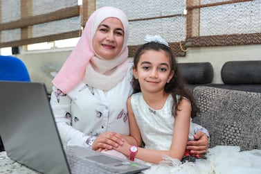 Dr Abeer Darwish's daughters, Rand (pictured) and Raghad have received full school scholarships under the Hayyakum initiative. Victor Besa / The National 