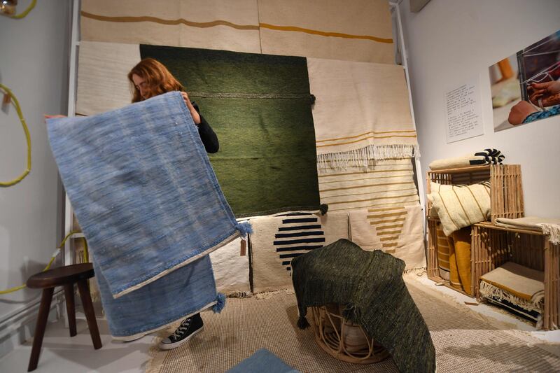 Rugs by Shanti's weavers on display in Tunis.