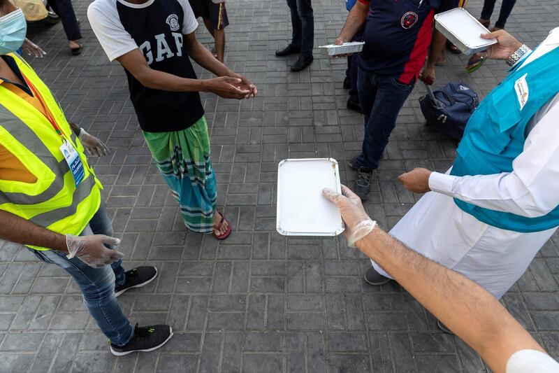 The Sri Lanka community along with the help of the Watani Al Emirate Foundation collectvely distributed two thousand / 2000 Iftar meals to workers in the Sonapur area of Dubai to mark International Workers Day on May 1st, 2021. 
Antonie Robertson / The National.
Reporter: None for National