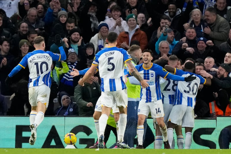 Brighton players celebrate after Solly March scored their second goal. AP