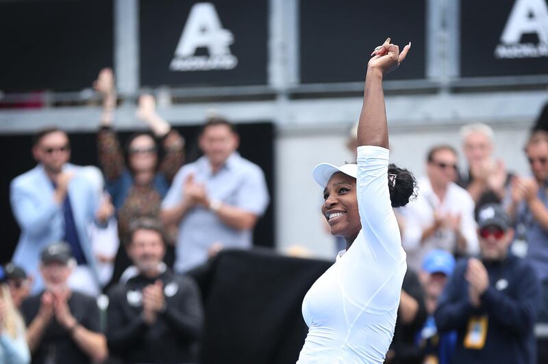 Serena Williams waves to the crowd after her first round win against Camila Giorgi. Getty Images