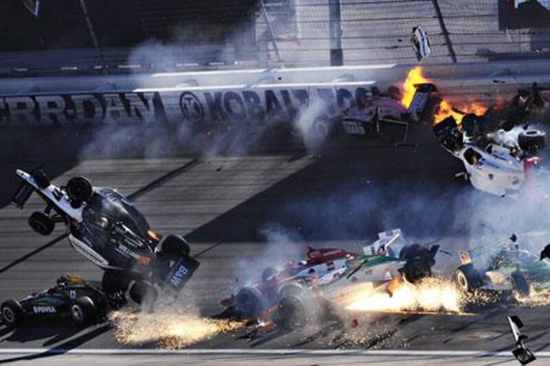 The car of Dan Wheldon, second left, is thrown into the air following an horrific crash at the Las Vegas Indy 300. The English driver died as a result of his injuries.