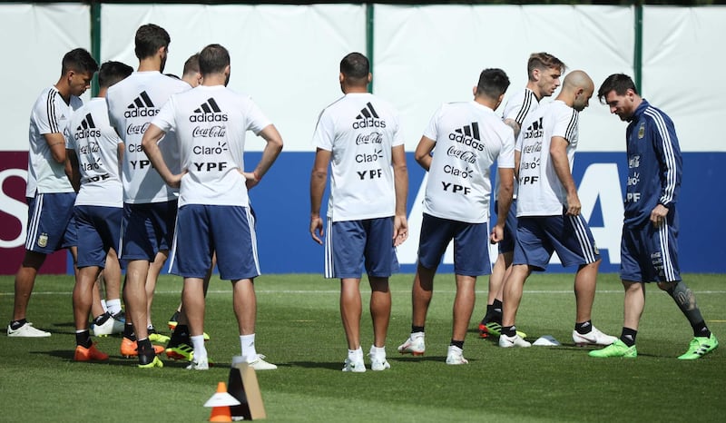 Argentina's Lionel Messi, right, with teammates during training. Albert Gea / Reuters