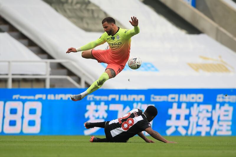 Defender Kyle Walker evades a challenge from  Danny Rose. EPA