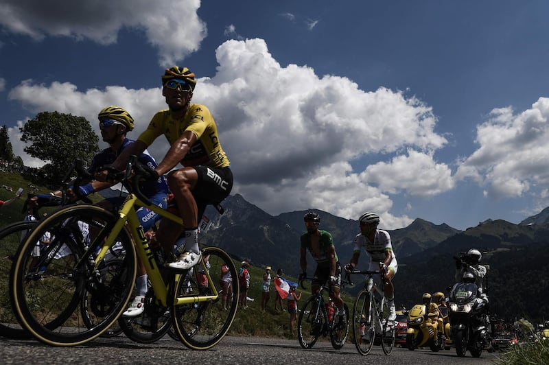 France's Julian Alaphilippe, Belgium's Greg van Avermaet, wearing the overall leader's yellow jersey, Slovakia's Peter Sagan, wearing the best sprinter's green jersey and France's Elie Gesbert ride during a 21-men breakaway in the 10th stage of the Tour de France between Annecy and Le Grand-Bornand. Jeff Pachoud / AFP