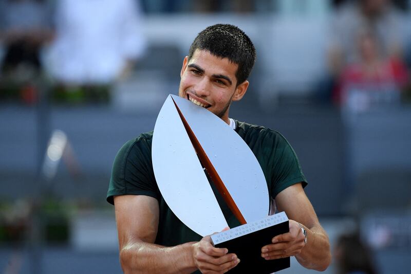Carlos Alcaraz poses with the Madrid Open trophy after beating Alexander Zverev in the final at the Caja Magica. AFP