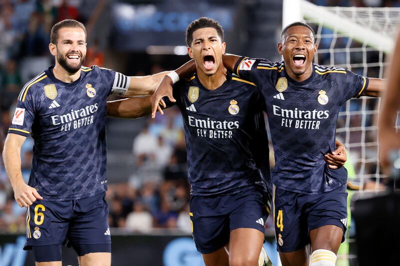 Real Madrid midfielder Jude Bellingham, centre, celebrates after scoring the winner against Celta Vigo on August 25, 2023.   EPA