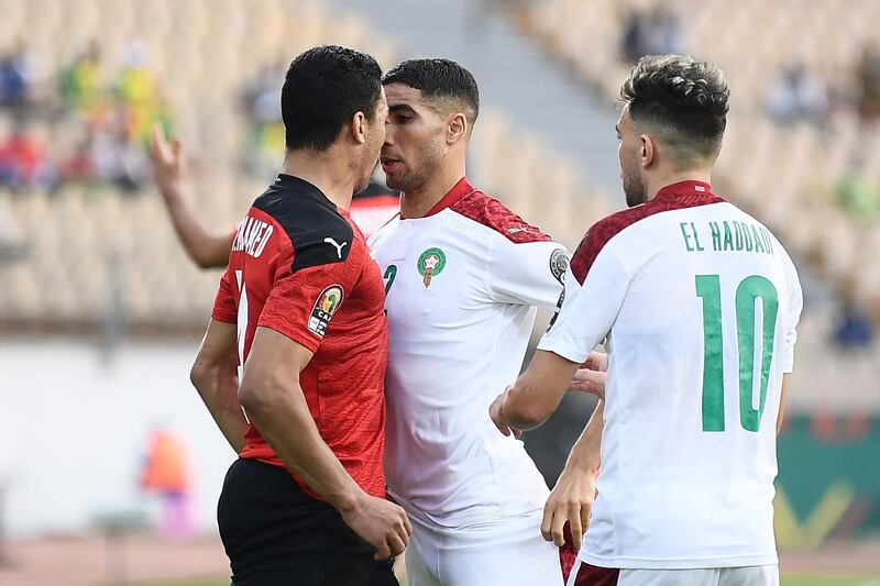 Egypt's Mostafa Mohamed and defender Achraf Hakimi of Morocco go head-to-head. AFP