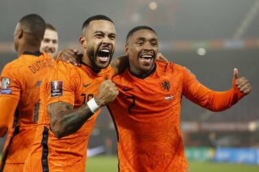 Memphis Depay (L) of Netherlands celebrates with teammate Steven Bergwijn after scoring the 2-0 goal during the FIFA World Cup 2022 group G qualyfing soccer match between the Netherlands and Norway at de Kuip Stadium in Rotterdam, Netherlands, 16 November 2021.   EPA / MAURICE VAN STEEN
