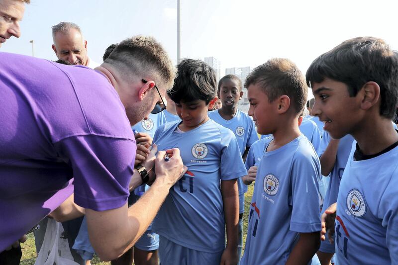 ABU DHABI, UNITED ARAB EMIRATES , Nov 30 – 2019 :- Aymeric Laporte, French footballer giving autographs to the students of Manchester City football school Abu Dhabi at the Zayed Sports city in Abu Dhabi. ( Pawan Singh / The National )  For Sports. Story by Jon Turner 