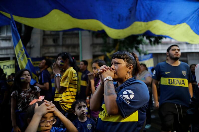 Boca Juniors soccer fans react to the second goal against their team. AP Photo/Natacha Pisarenko