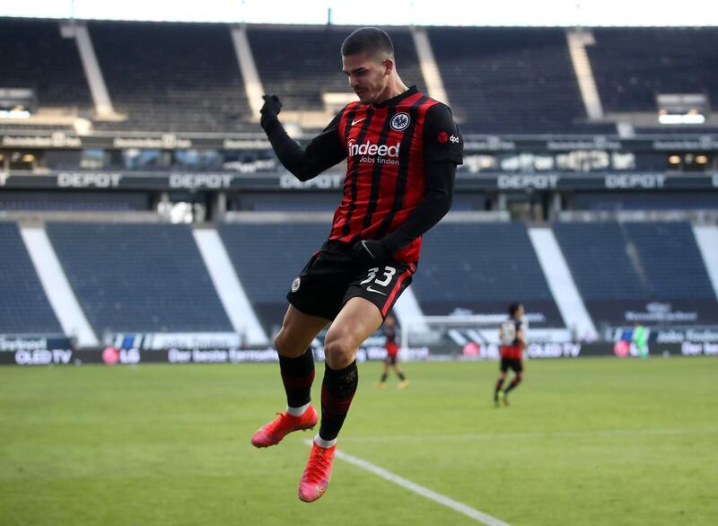 FRANKFURT AM MAIN, GERMANY - FEBRUARY 14: Andre Silva of Eintracht Frankfurt  celebrates after scoring their team's first goal  during the Bundesliga match between Eintracht Frankfurt and 1. FC Koeln at Deutsche Bank Park on February 14, 2021 in Frankfurt am Main, Germany. Sporting stadiums around Germany remain under strict restrictions due to the Coronavirus Pandemic as Government social distancing laws prohibit fans inside venues resulting in games being played behind closed doors. (Photo by Alex Grimm/Getty Images)