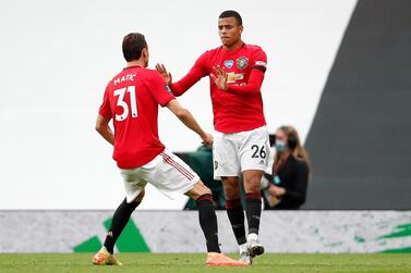 Manchester United's Mason Greenwood (right) celebrates scoring his side's first goal  with teammate Nemanja Matic. PA