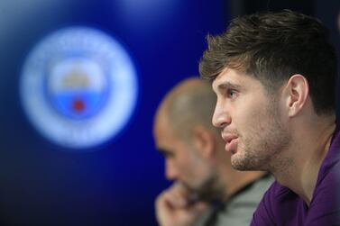 Manchester City defender John Stones and manager Pep Guardiola have taken different approaches to upcoming fixtures. Lindsey Parnaby / AFP