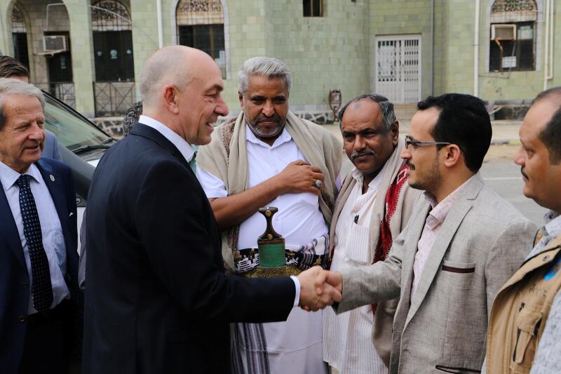 Danish Major General Michael Lollesgaard who heads a United Nations team tasked with monitoring a ceasefire between the Iranian-aligned Houthi group and Saudi-backed Yemeni government forces shakes hands with Houthi-appointed local officials ahead of a meeting in Hodeidah, Yemen February 13, 2019. REUTERS/Abduljabbar Zeyad