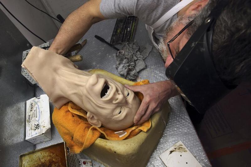 Sculptor Eric Saint Chaffray works on the head of Rolling Stones lead singer Mick Jagger in their workshop. Philippe Wojazer / Reuters 