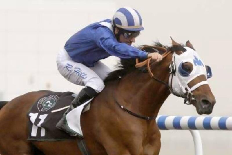 Dubai, United Arab Emirates, Feb 16 2012, Meydan Racecourse Tenth Carnival Race Meeting,Race 2- KANDAR DU FALGAS ridden by Richard Hills and trained by Doug Warson pulls away from the fiels at the 100 meter pole to win the second race at meydan Racecourse Feb 17 2012. Mike Young / The National??