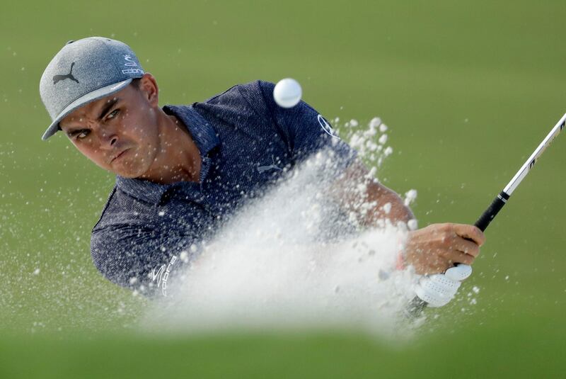 Rickie Fowler hits from the bunker on the 16th hole during the first round of the PGA Championship. Chris O'Meara / AP Photo
