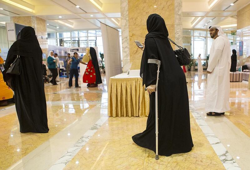 Advocates for those who have special needs, including Salma Al Tamimi, who overcame childhood polio to become a sign language trainer and volunteer at the deaf association in Al Ain, attend a road show on the problems of having disabilites in Abu Dhabi yesterday. Christopher Pike / The National