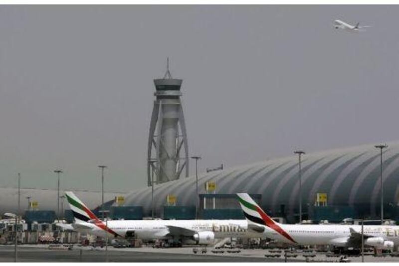 The expansion plans for Dubai airport had a positive impact on construction stocks, with the Dubai index gaining 0.3 per cent. Kamran Jebreili / AP Photo