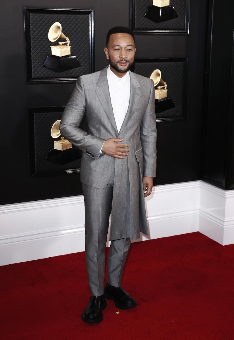 John Legend  wears an asymmetric suit jacket by Alexander McQueen for the 62nd Annual Grammy Awards.  EPA