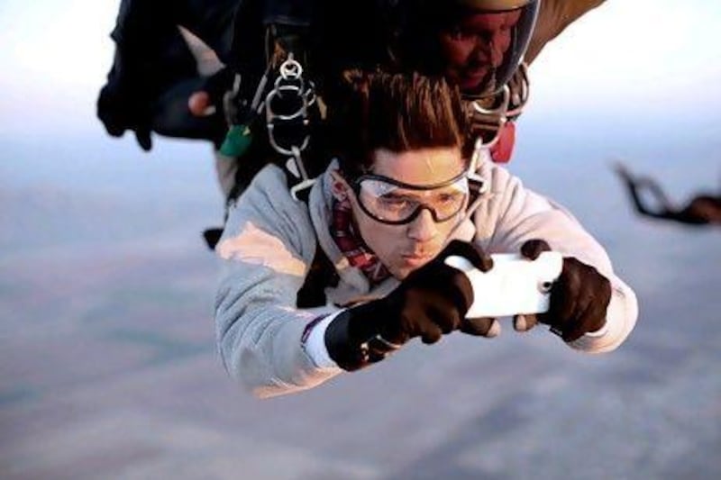 HTC challenged Nick Jojola, above, who had never skydived before, to take pictures using HTC One handsets while freefalling at more than 200kph. Courtesy HTC