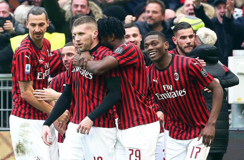 Ante Rebic (C-L) celebrates with teammates after scoring the winning goal for AC Milan against Udinese. EPA