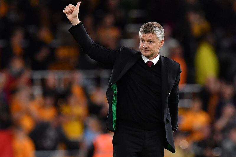 Manchester United' manager Ole Gunnar Solskjaer applauds the fans at the final whistle. AFP