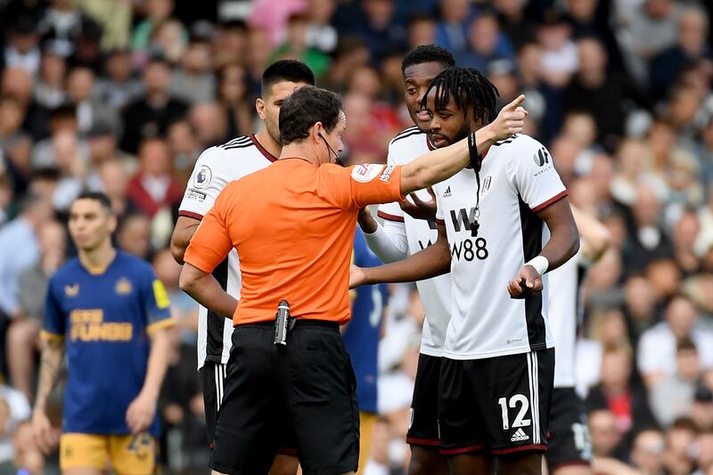 Nathaniel Chalobah of Fulham reacts after being shown a red card by match referee Darren England. Getty