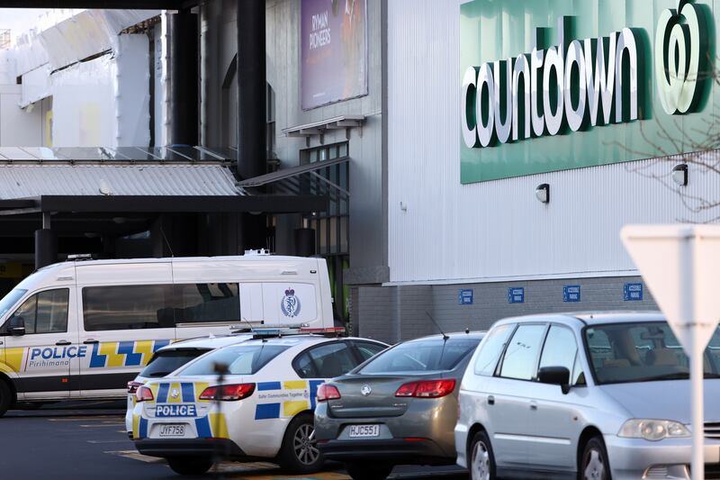 Police guard the area around Countdown LynnMall where a violent extremist reportedly stabbed six people before being shot by police. Getty Images