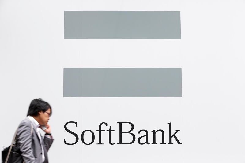 epa07143091 (FILE) - A file photo dated 30 July 2013 showing a pedestrian, talking on his mobile phone, walking past the logo of SoftBank Corp. in Tokyo, Japan (reissued 05 November 2018). Softbank Group on 05 November 2018 released their six-month period ended 30 September 2018 results, saying their operating income stood at 1,420.7 billion Yen, an increase of 62.4 per cent year-on-year, while net sales for the same period stood at 4,653,853 billion Yen, an increase of 5.5 per cent from 4,411,135 billion Yen the previous year.  EPA/KIYOSHI OTA