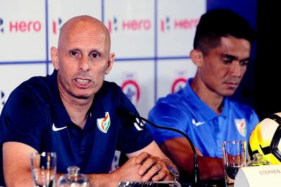 FILE - In this May 31, 2018, file photo, India's soccer coach Stephen Constantine speaks with captain Sunil Chhetri by his side during a pre-tournament press conference for the Hero Intercontinental Cup in Mumbai, India. Soccerâ€™s two biggest sleeping giants India and China meet in Suzhou, China on Saturday, Oct. 13, for the first time since 1997. Representing around one-third of the worldâ€™s population, India and China both show signs of growing strength in their domestic leagues, despite limited international success. (AP Photo/Rajanish Kakade, File)