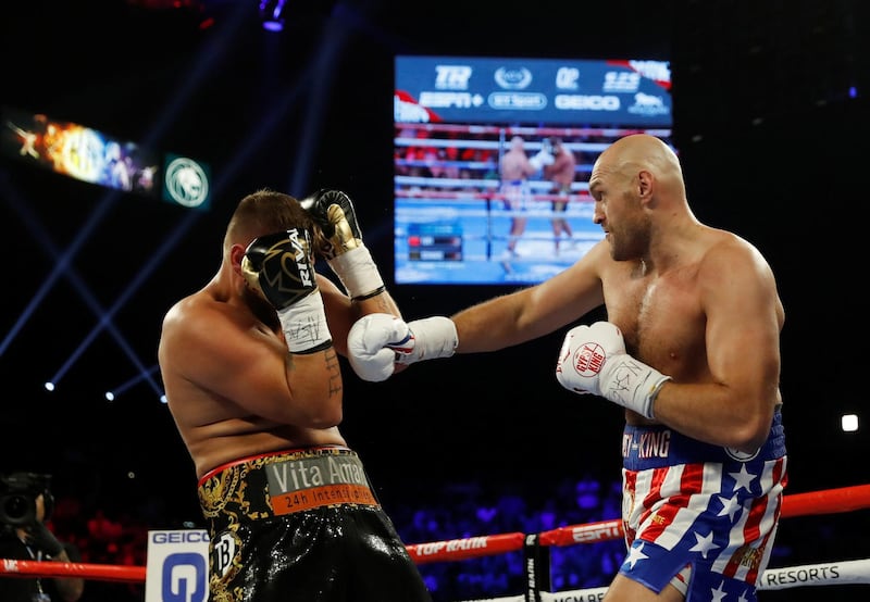 Tyson Fury and Tom Schwarz in action. REUTERS