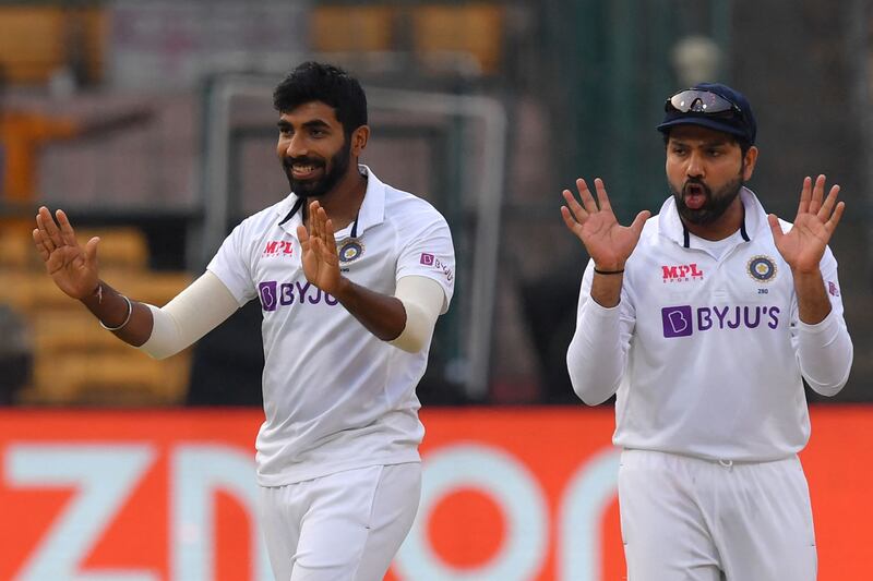 India bowler Jasprit Bumrah, left, celebrates after taking the wicket of Sri Lanka captain Dimuth Karunaratne. AFP