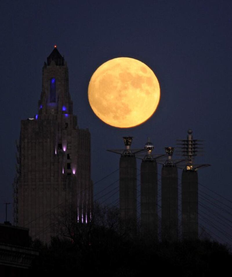 The supermoon rises over the Power and Light building in downtown Kansas City, Missouri, US. Dave Kaup / Reuters