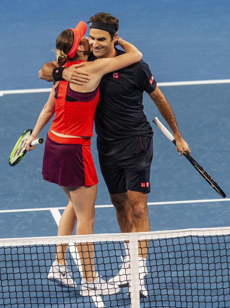 Roger Federer and Belinda Bencic of Switzerland celebrate after beating the USA 4-2, 4-3 in the mixed doubles match. EPA