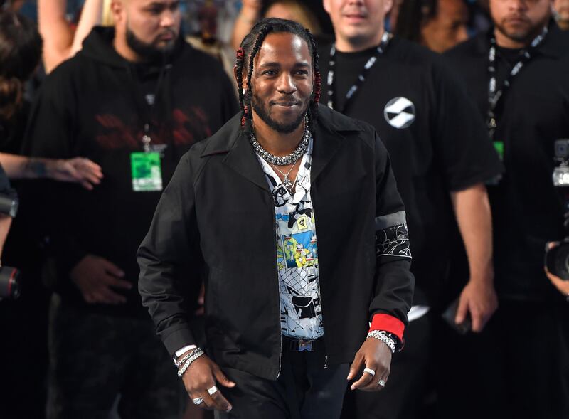FILE - In this Aug. 27, 2017 file photo, Kendrick Lamar arrives at the MTV Video Music Awards at The Forum  in Inglewood, Calif.  Lamar and Olympic gymnast Aly Raisman are among the celebrities, athletes and business leaders heading to Boston for Forbesâ€™ Under 30 Summit. The four-day event focused on technology and business starts Sunday, Oct. 1 and runs through Wednesday. (Photo by Chris Pizzello/Invision/AP, File)