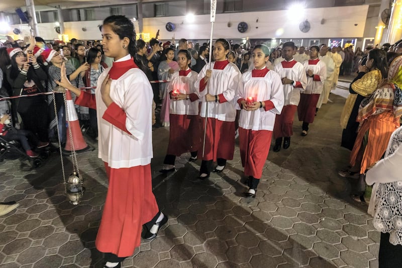 DUBAI, UNITED ARAB EMIRATES. 25 DECEMBER 2019. Midnight Mass at St Mary’s in Dubai to celebrate Christmas. The procession that marks the start of the ceremony. (Photo: Antonie Robertson/The National) Journalist: None. Section: National.
