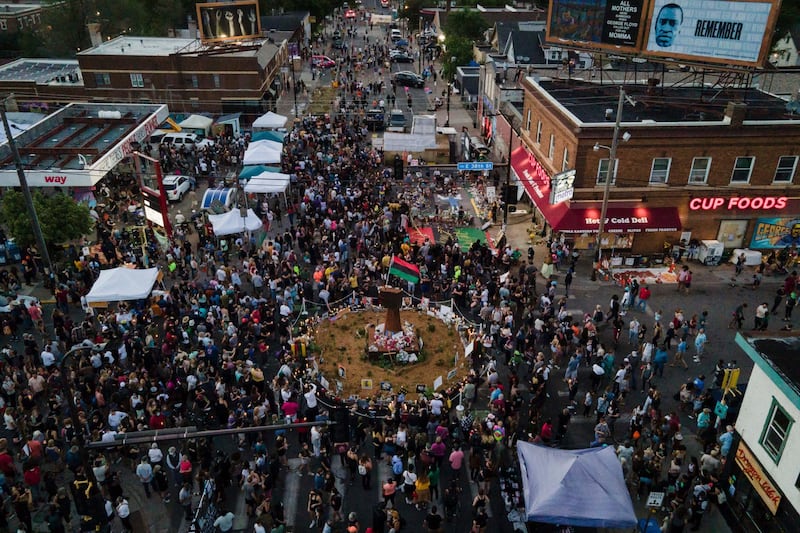 People gather at George Floyd Square in Minneapolis. AP